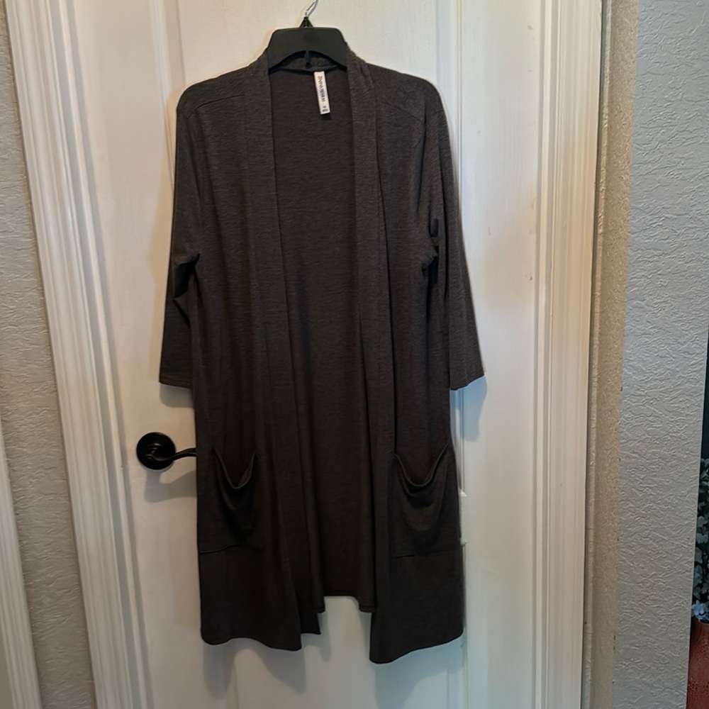 Gray duster in a 1x. Midi length with a soft stretch fabric
